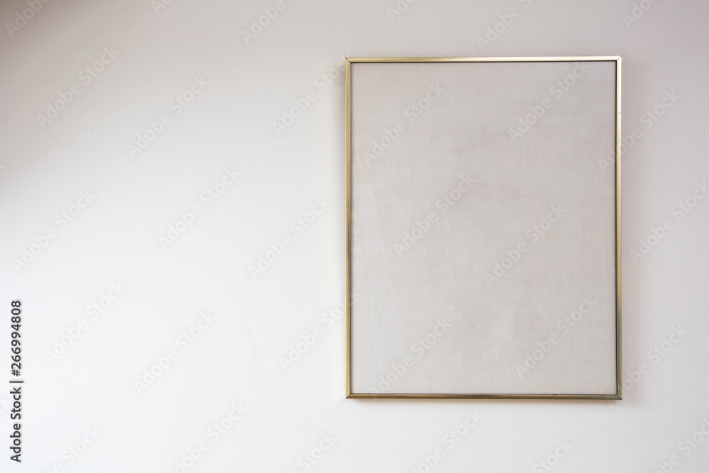Blank painting on white wall with golden frame, space for text Blank painting on white wall with golden frame, space for text