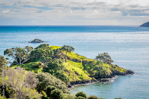 Hiking on the beautiful coast of Doubtless Bay in the Far North of New Zealand photo