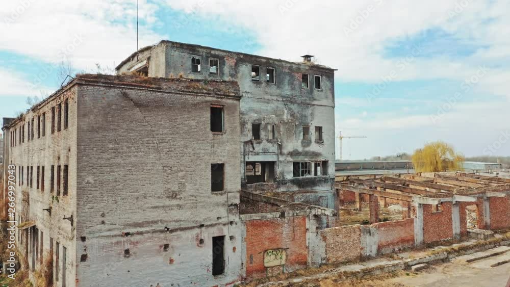 Abandoned building. Aerial view of an old factory ruin and broken windows. Abandoned building. Aerial view of an old factory ruin and broken windows.