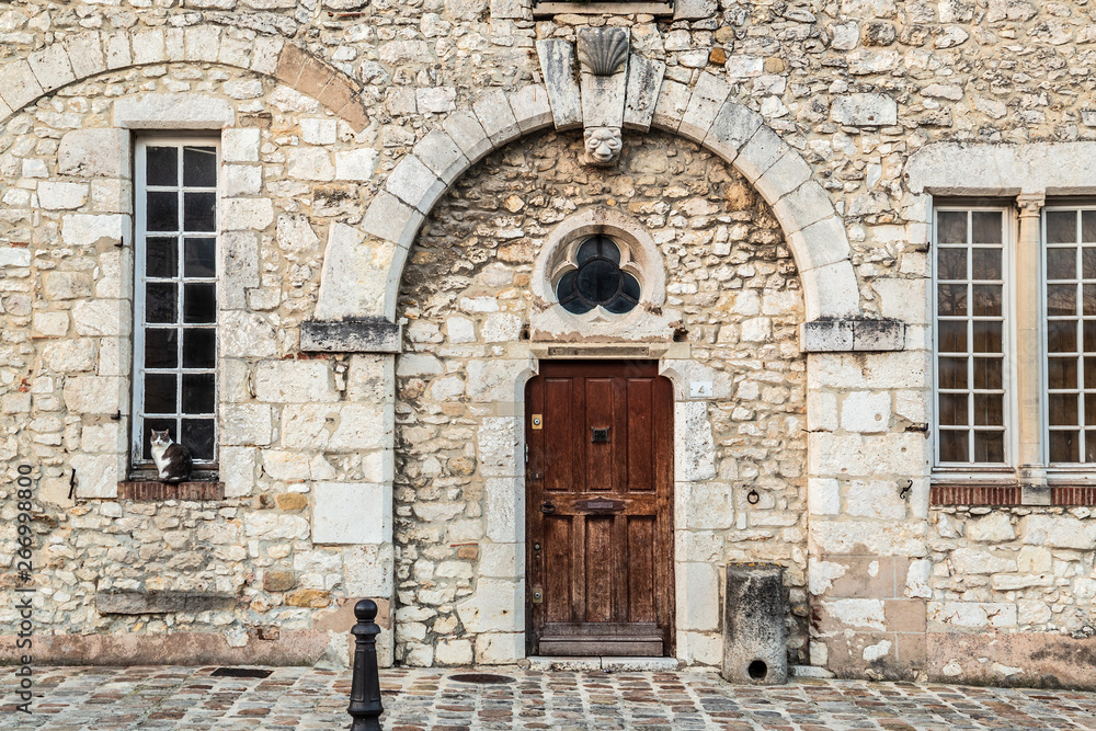 Old building with cat on window sill, Northern France