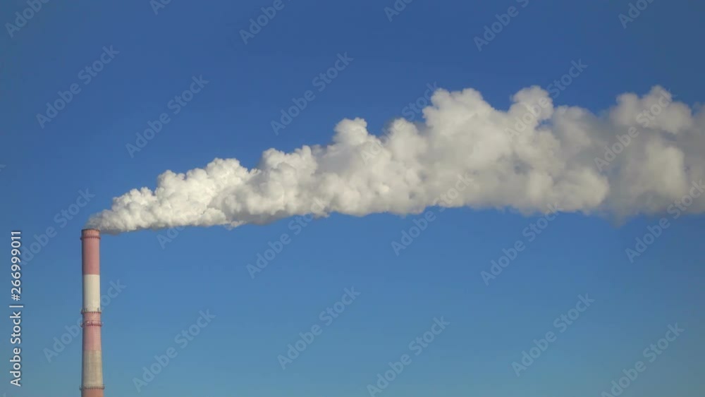 One pipe and smoke against blue sky. One pipe and smoke against blue sky.