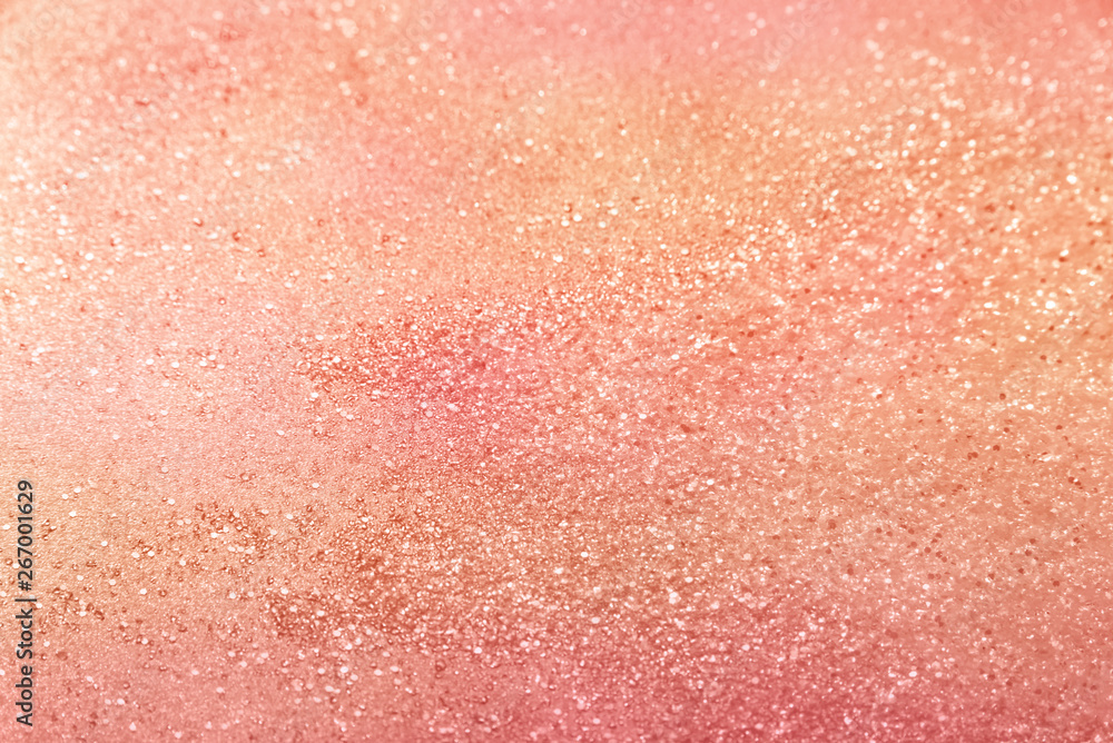 Classic living coral, peach, salmon glitter background with selective focus - abstract texture