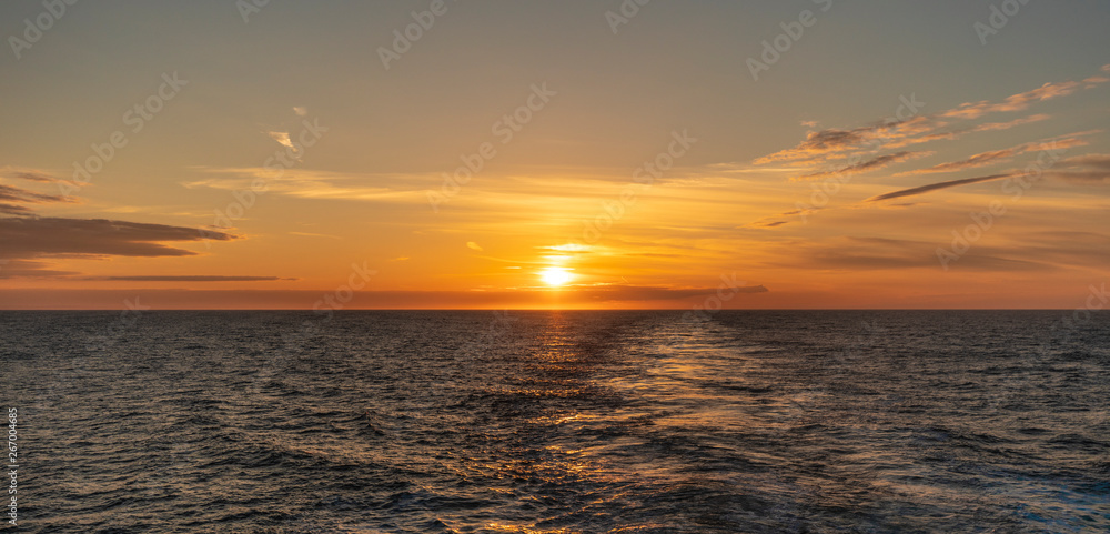 Sunset from the ferry over water