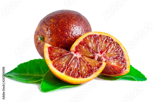 Blood orange with green leaves isolated on white background.