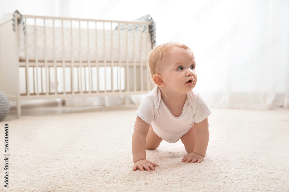Cute little baby crawling on carpet indoors - obrazy, fototapety, plakaty 