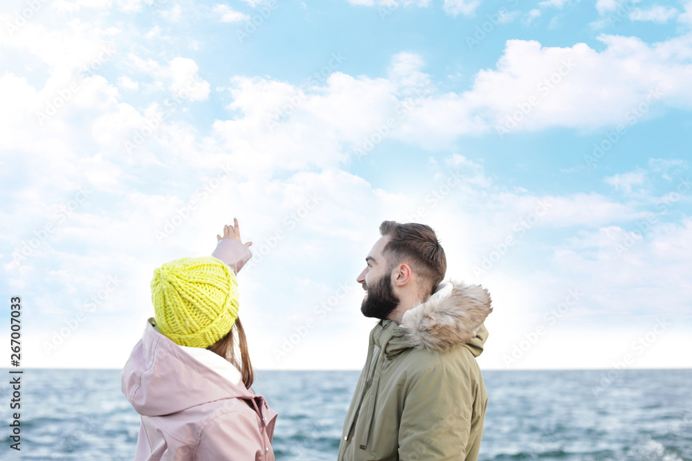Lovely young couple spending time near sea Lovely young couple spending time near sea