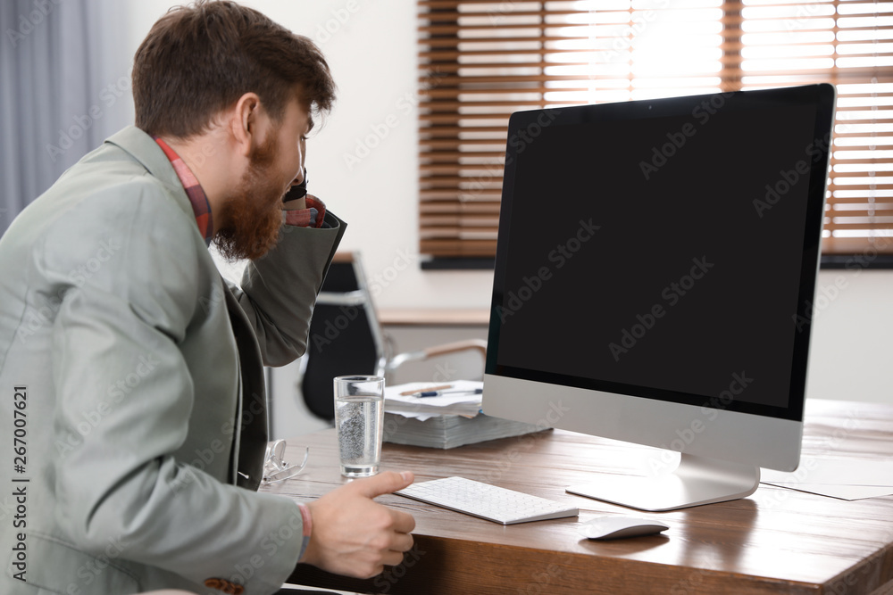 Man using video chat on computer in home office. Space for text