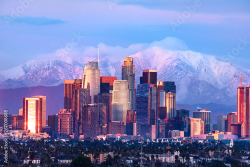 Wallpaper Mural Downtown Los Angeles skyline with snow capped mountains behind at sunset Torontodigital.ca