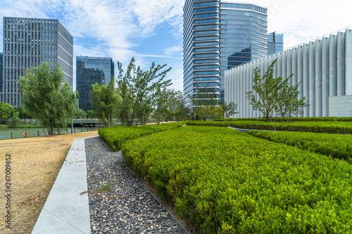 beautiful green field near modern office building.