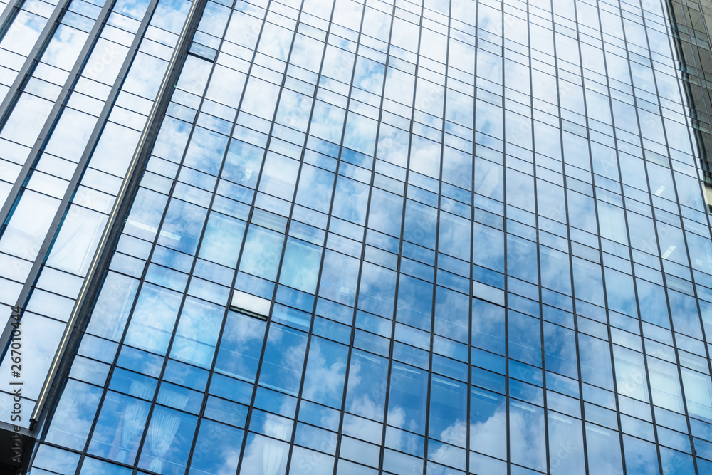 Clouds Reflected in Windows of Modern Office Building.