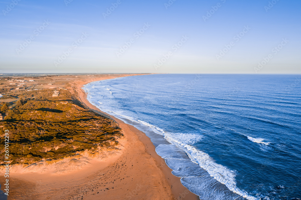 Ocean coastline at sunset with copy space