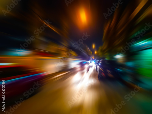 Abstract speed motion blur in city on night road and neon light.