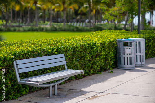 Stock photo park bench and trash cans recycling bins