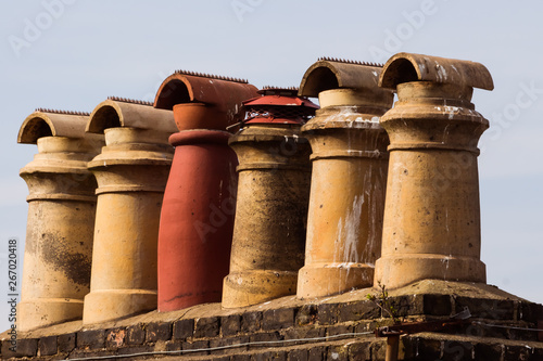Photography old chimneys of a roof of an old house in the UK
