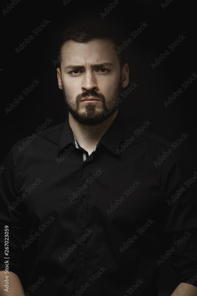 Obraz premium Portrait of Man in Black Indoors