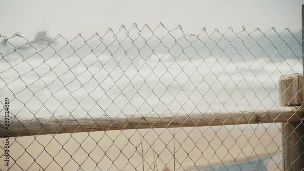 Fence in foreground at the ocean Fence in foreground at the ocean
