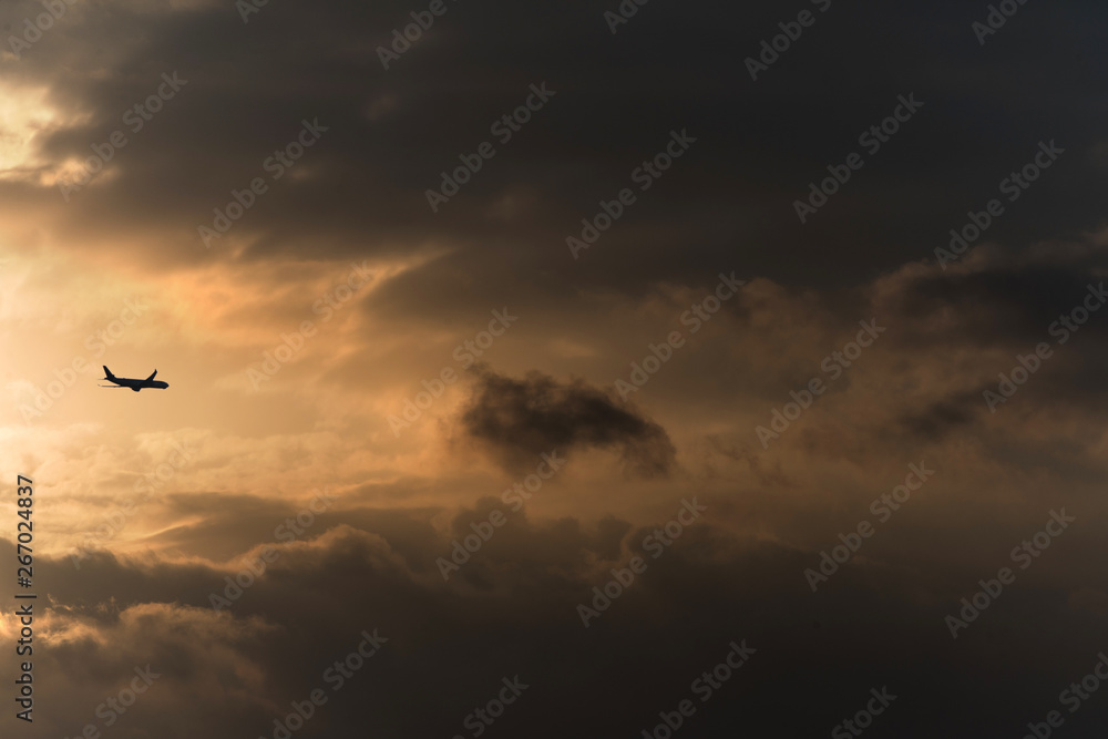 Twilight sky with effect of light pastel orange colors. Colorful sunset of soft clouds.