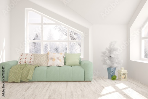 Stylish room in white color with sofa and winter landscape in window. Scandinavian interior design. 3D illustration © AntonSh