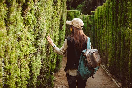 Photography Young woman walking in the park labyrinth
