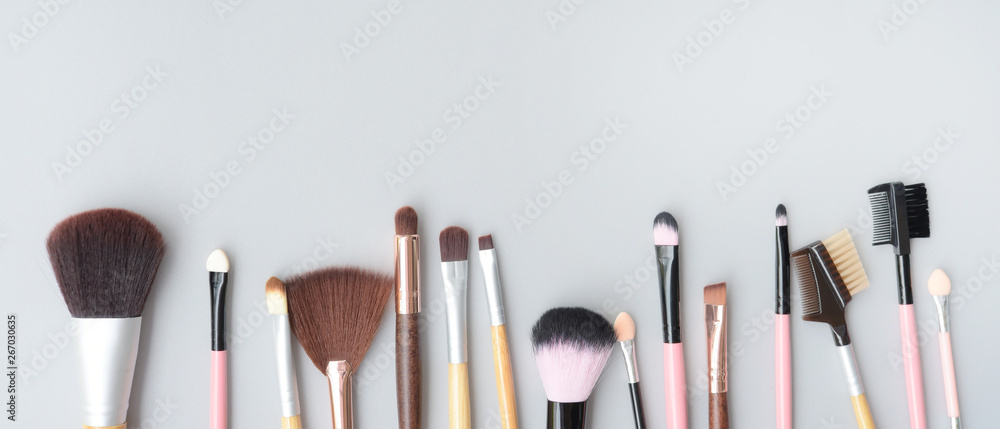 Set of makeup brushes for background - obrazy, fototapety, plakaty 