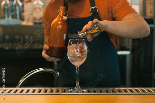 Barman making a cocktail at the bar