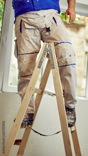 Worker inside the house - renovation fixes.