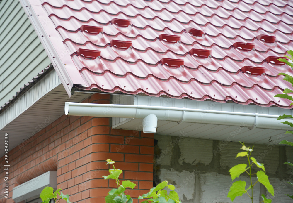 Metal roof house rooftop corner with meal snow protection boards