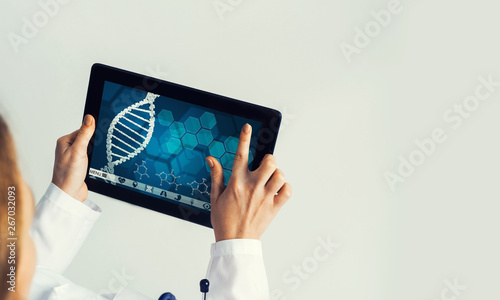 Close of female doctor hands working with tablet pc computer