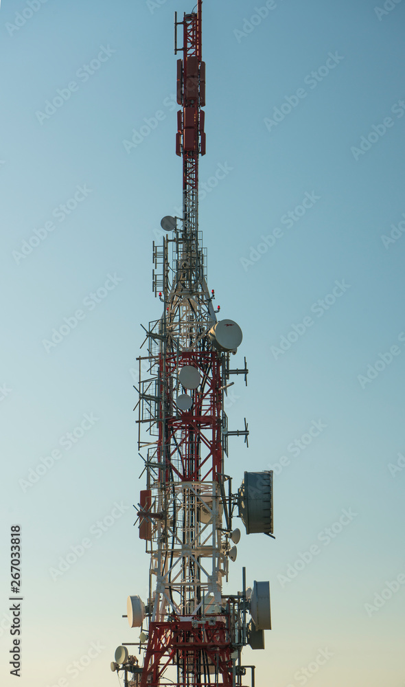 communications tower with antennas against blue sky communications tower with antennas against blue sky
