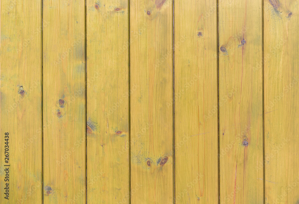 Naklejka premium wooden yellow wall background