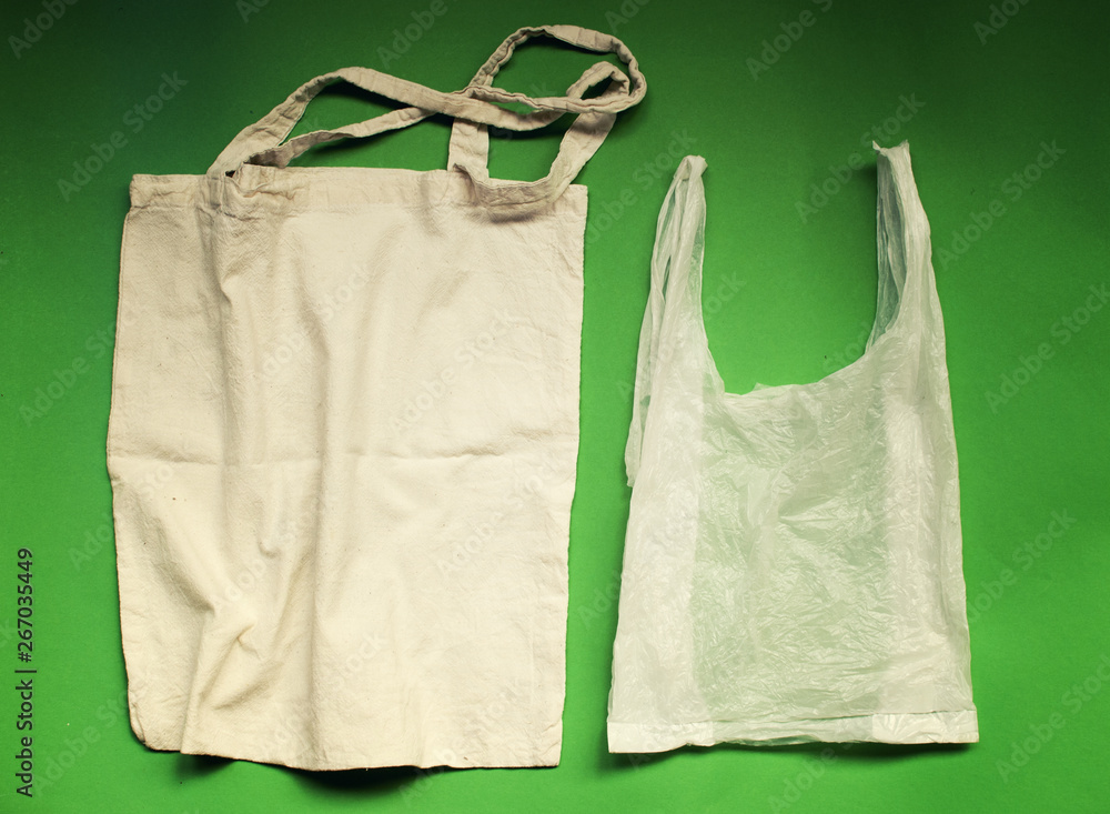 Natural reusable linen fabric for shopping VS plastic bags. Eco friendly lifestyle. No pollution choice concept.