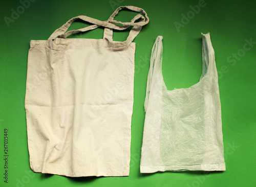 Natural reusable linen fabric for shopping VS plastic bags. Eco friendly lifestyle. No pollution choice concept.