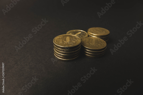 Wallpaper Mural many gold coins lying on top of each other on a black background Torontodigital.ca