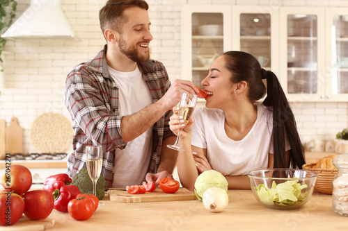 Lovely young couple cooking...