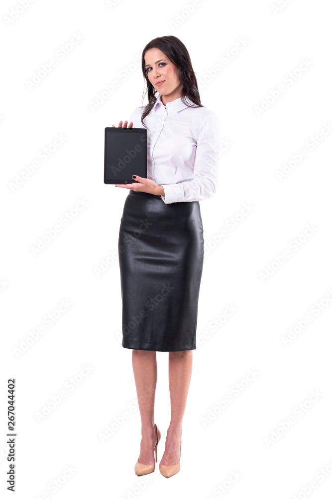 Happy confident attractive business woman holding and showing blank tablet screen. Full body isolated on white background. Happy confident attractive business woman holding and showing blank tablet screen. Full body isolated on white background.