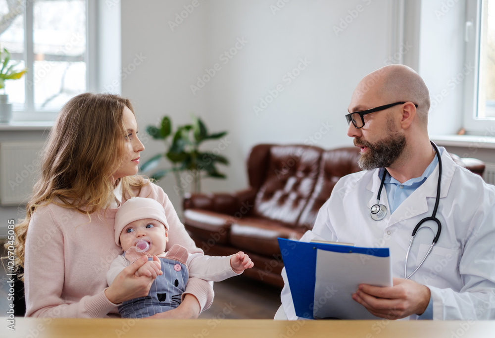 Mother with baby visiting pediatrician Mother with baby visiting pediatrician