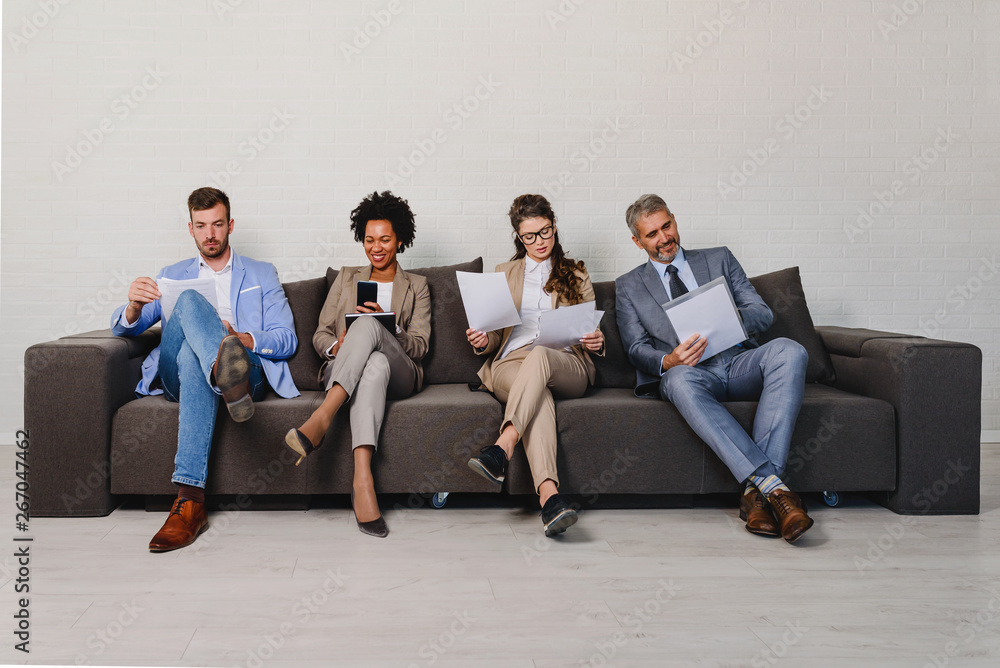 Diverse business people waiting for an interview Diverse business people waiting for an interview