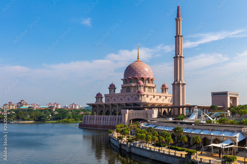 Kuala Lumpur/Malaysia: 22 April 2019: beautiful dome lid pink Masjid Putra Putra Mosque Muslim mosque of Putrajaya famous tourist destination religion in Malaysia