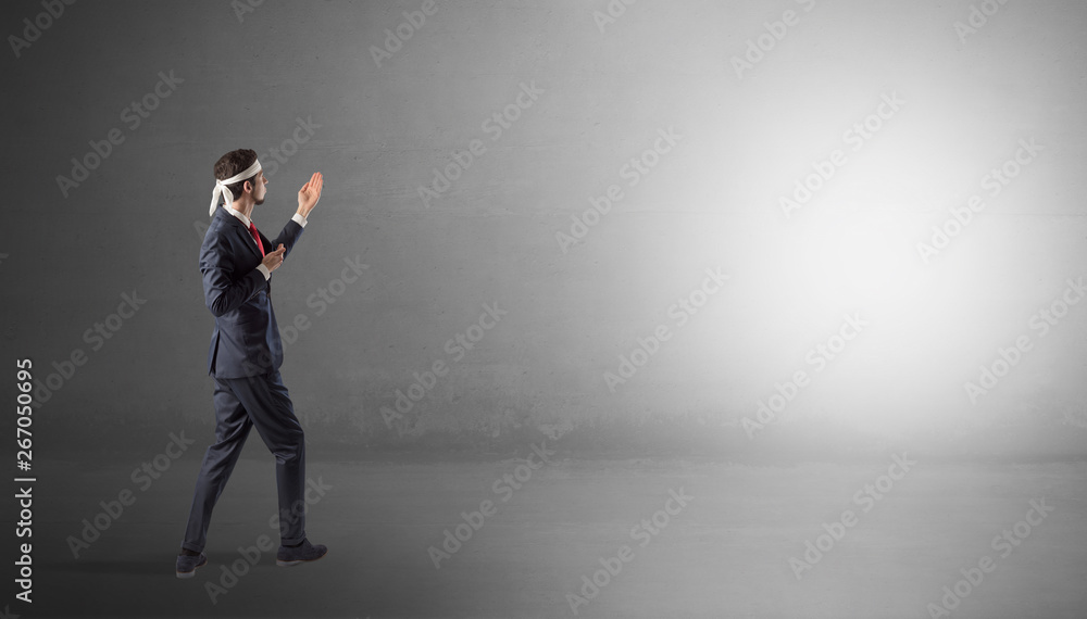 Businessman fighting with boxing gloves in an empty space
Businessman fighting with boxing gloves in an empty space