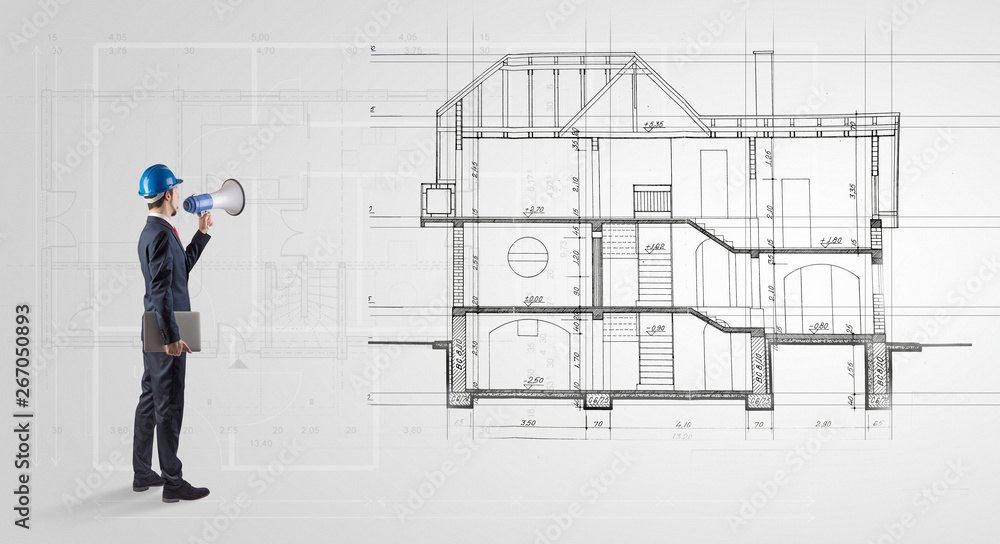 Architect watching a 2 dimension house plan
Architect watching a 2 dimension house plan