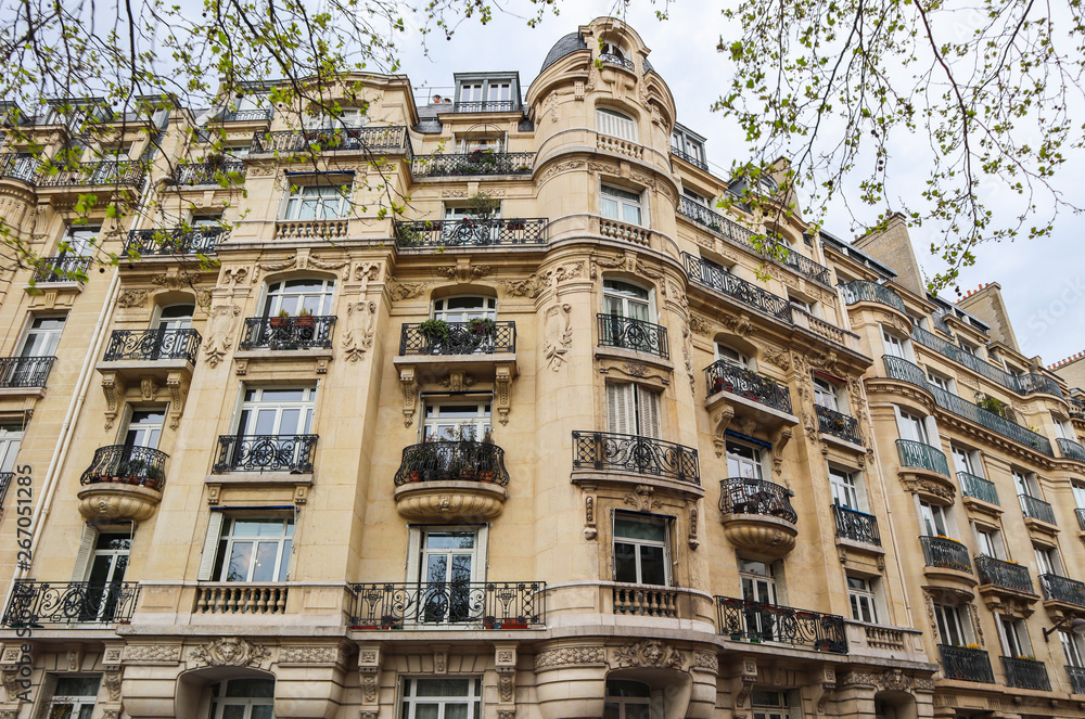 Architecture of Paris France. Facade of a traditional apartment building