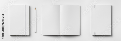 white notebook isolated on white background photo