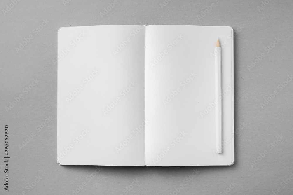 white notebook isolated on grey background white notebook isolated on grey background