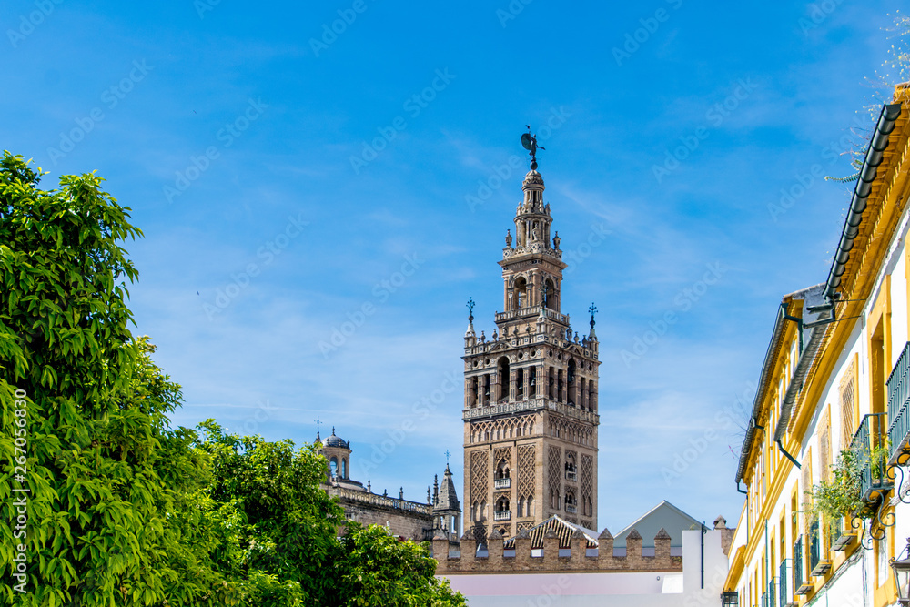 The Giralda is the bell tower of the Cathedral of Seville. Its height is 343 feet and is the former minaret of the mosque that stood on the site under Muslim rule. The Giralda is the bell tower of the Cathedral of Seville. Its height is 343 feet and is the former minaret of the mosque that stood on the site under Muslim rule.