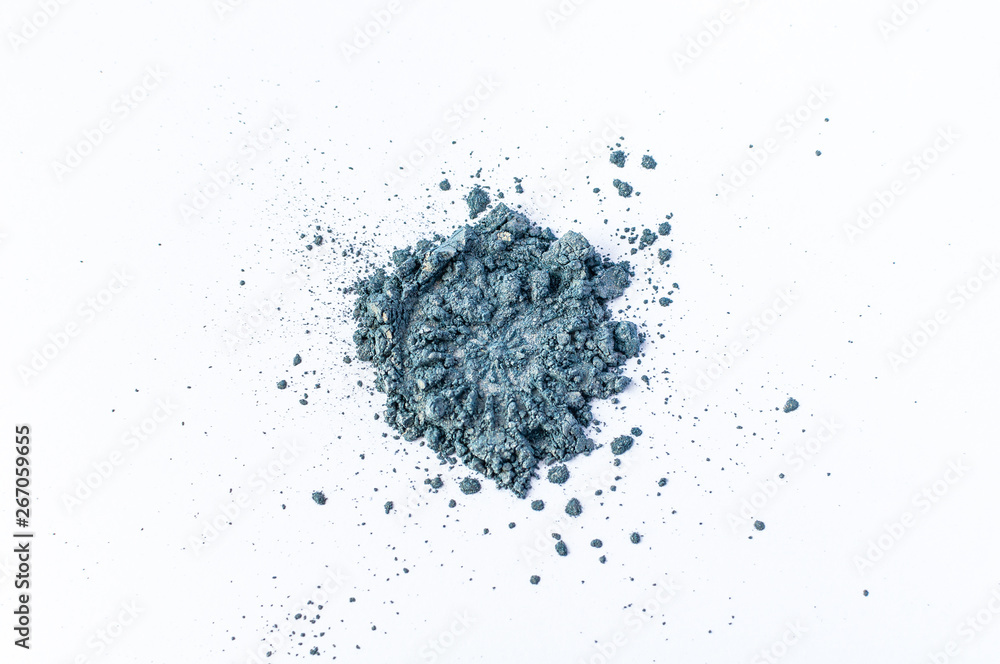 Natural blue colored satin pigment. Loose cosmetic powder. Eyeshadow pigment isolated on a white background, close-up