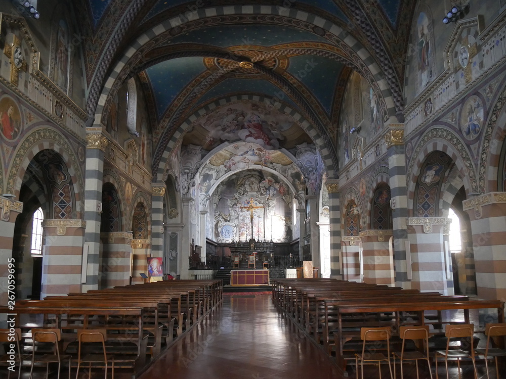 Saint Mary Cathedral in Bobbio. The interior has modern decoration in the three naves, in the presbytery and in the dome. Saint John chapel has a splendid fresco representing the Annunciation.