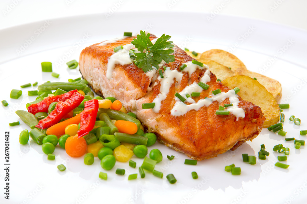 Salmon Steak with Vegetables and fried potatoes. Salmon Steak with Vegetables and fried potatoes.