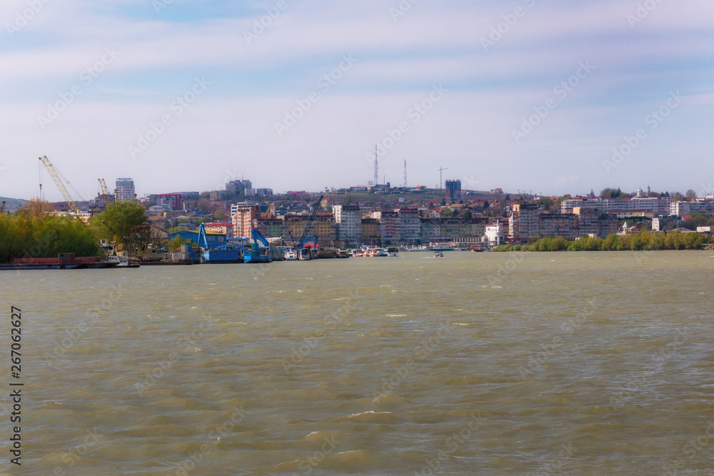Obraz premium Danube River near Tulcea, Romania. Here begins the biosphere reserve Delta of the Danube. Walk with a small cruise ship.