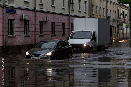 Photography Cars drive through the flooded city