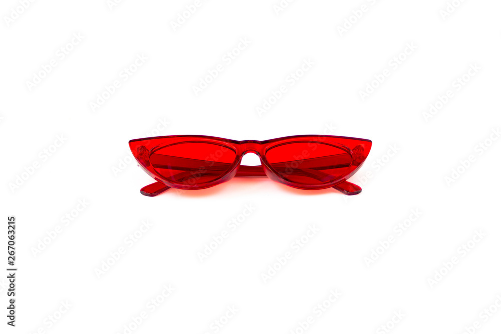 Red cat eye sunglasses with thick frame at isolated white background, front view folded Red cat eye sunglasses with thick frame at isolated white background, front view folded